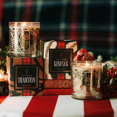 Classic Holiday Pair Kinfolk and Tradition holiday candles with festive decor