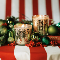 Classic Holiday Pair Kinfolk and Tradition holiday candles with festive decor