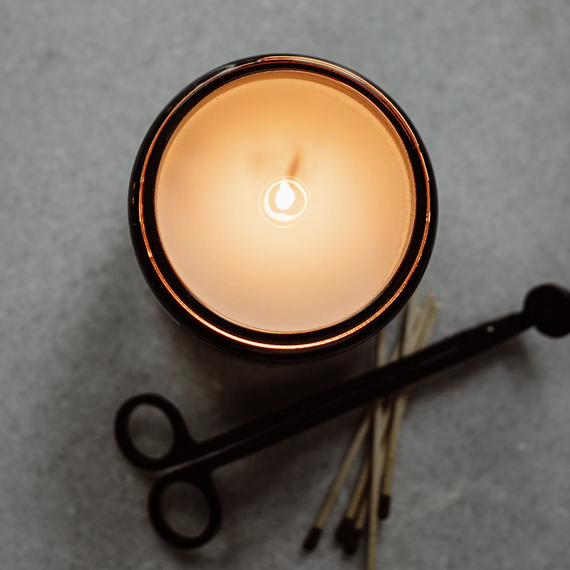 image of candle from the top with wax burning to the edges